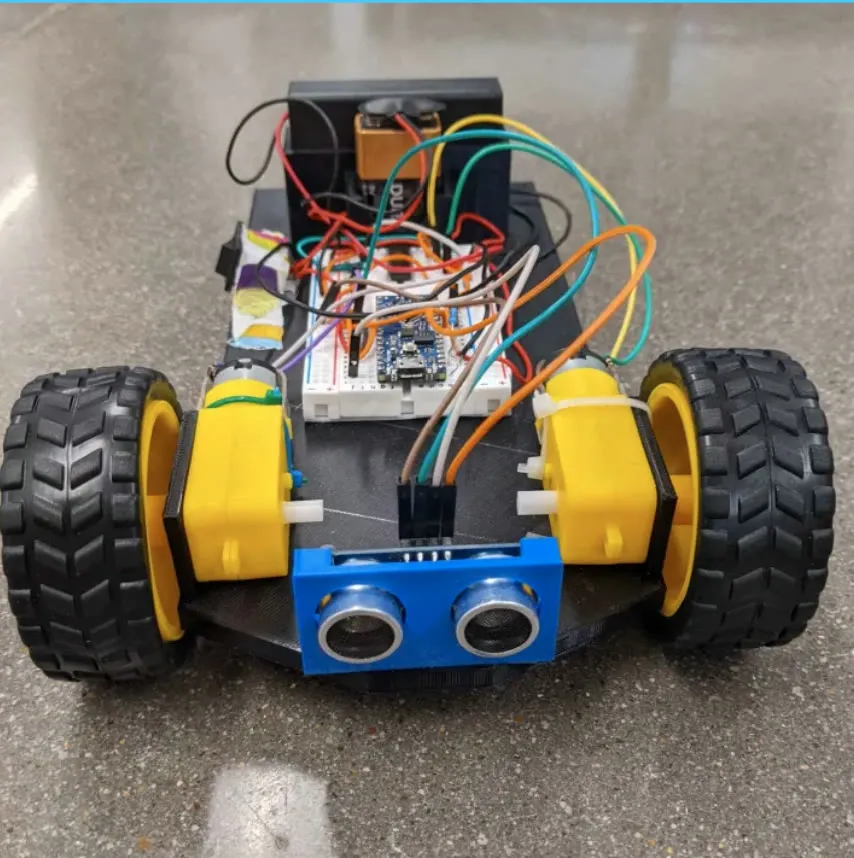 Front view of the first Eaglets robot kit, with large wheels and a distance sensor.