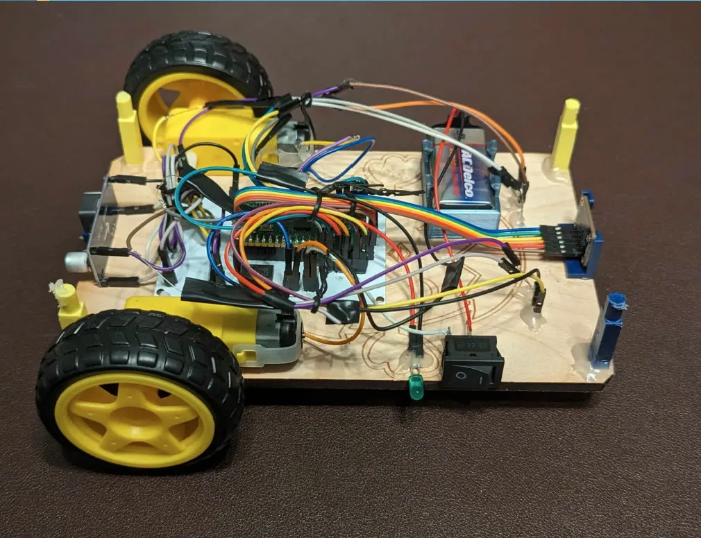 Three-quarter view of Eaglets robot kit version 3.2, showing its chassis, wheels, and wiring.